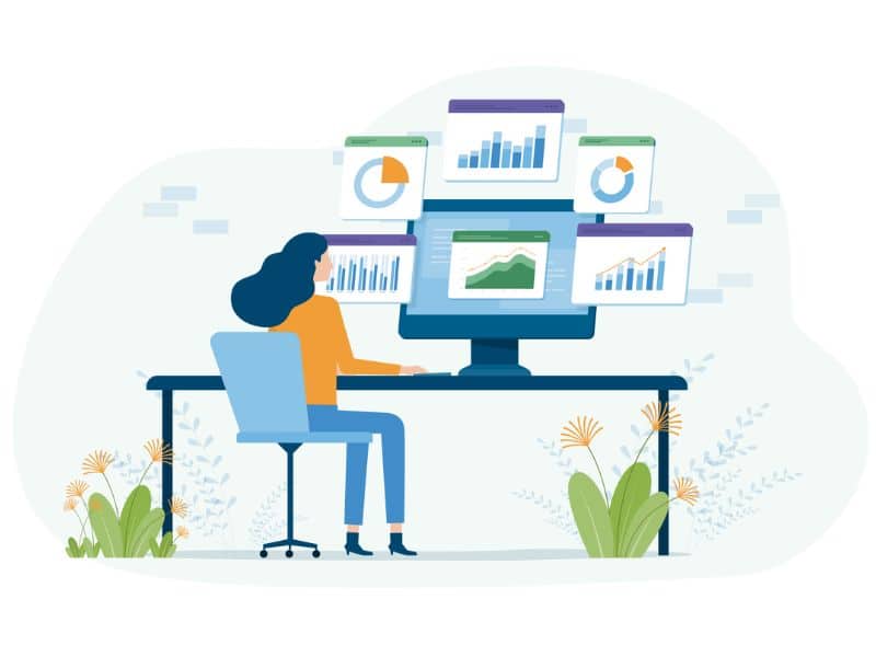 une femme assise à un bureau avec un ordinateur portable